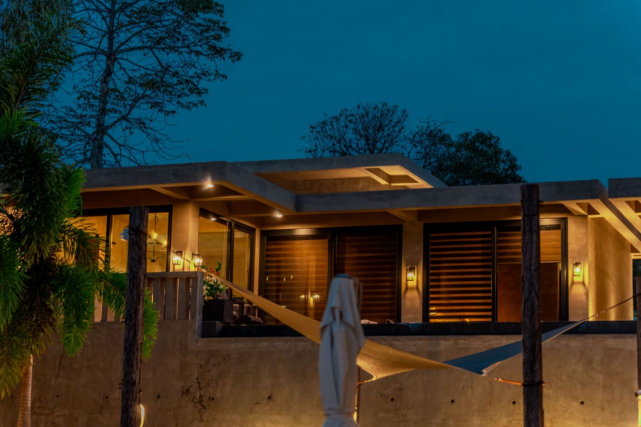An elevated Horizon cabin glowing at dusk, set apart for privacy