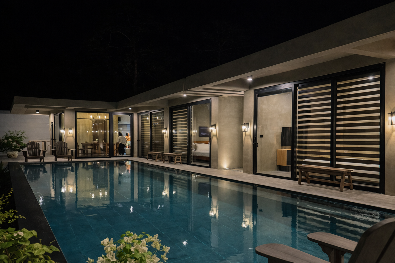 The lit Horizon infinity pool at night, stretching along the two cabins
