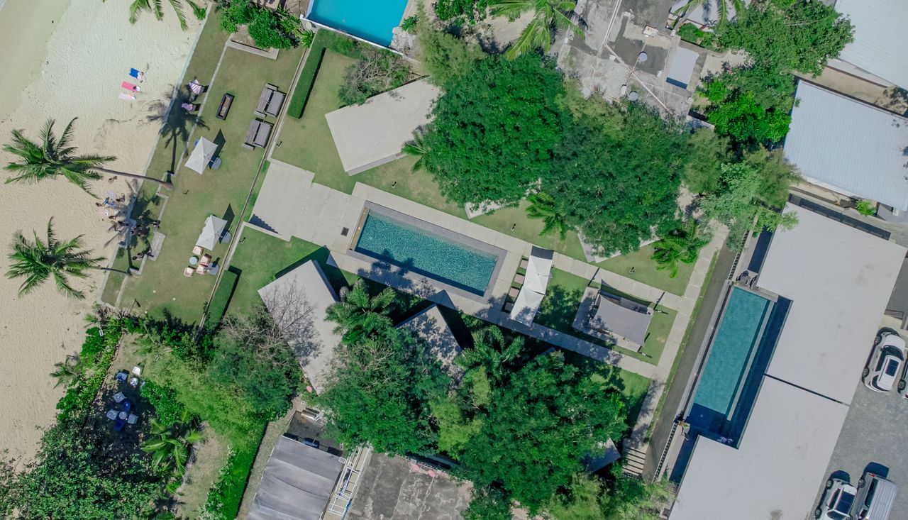 Aerial of the pools and gardens at Veue Beach Cabins