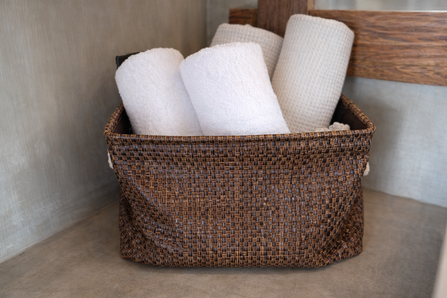 A basket of fresh rolled towels from housekeeping at Veue