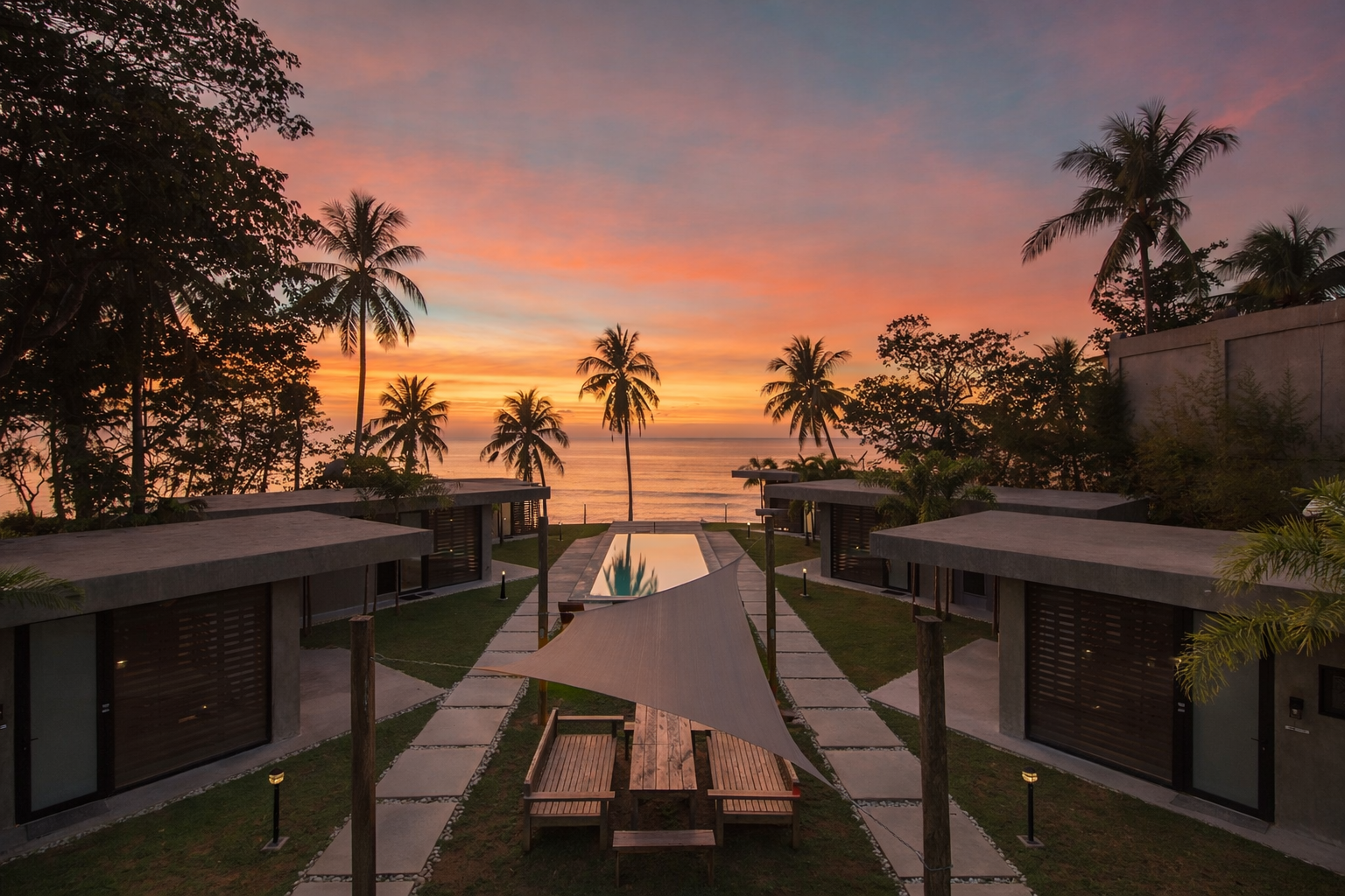 Aerial view of Veue Beach Cabins at sunset