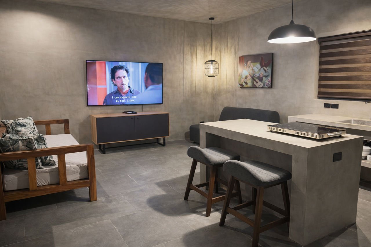 A Horizon living area with a Smart TV, daybed, and kitchen island