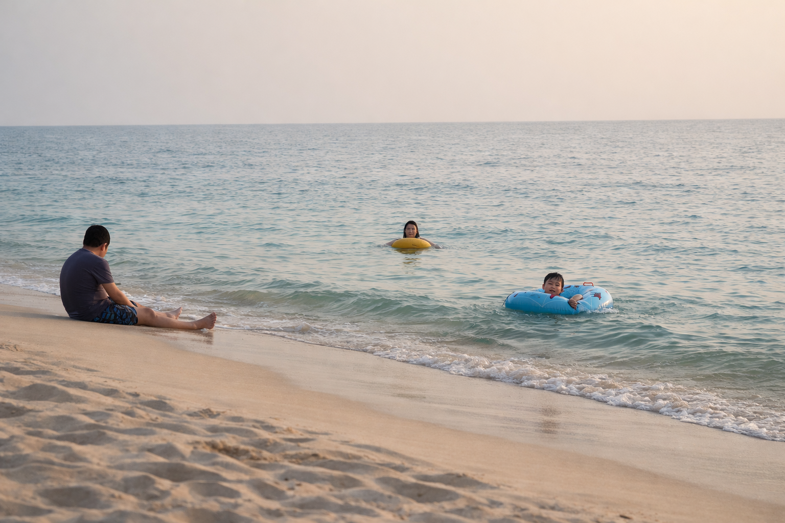 A pair of low chairs in the shade at the edge of Patar Beach, set up for an afternoon of doing nothing.