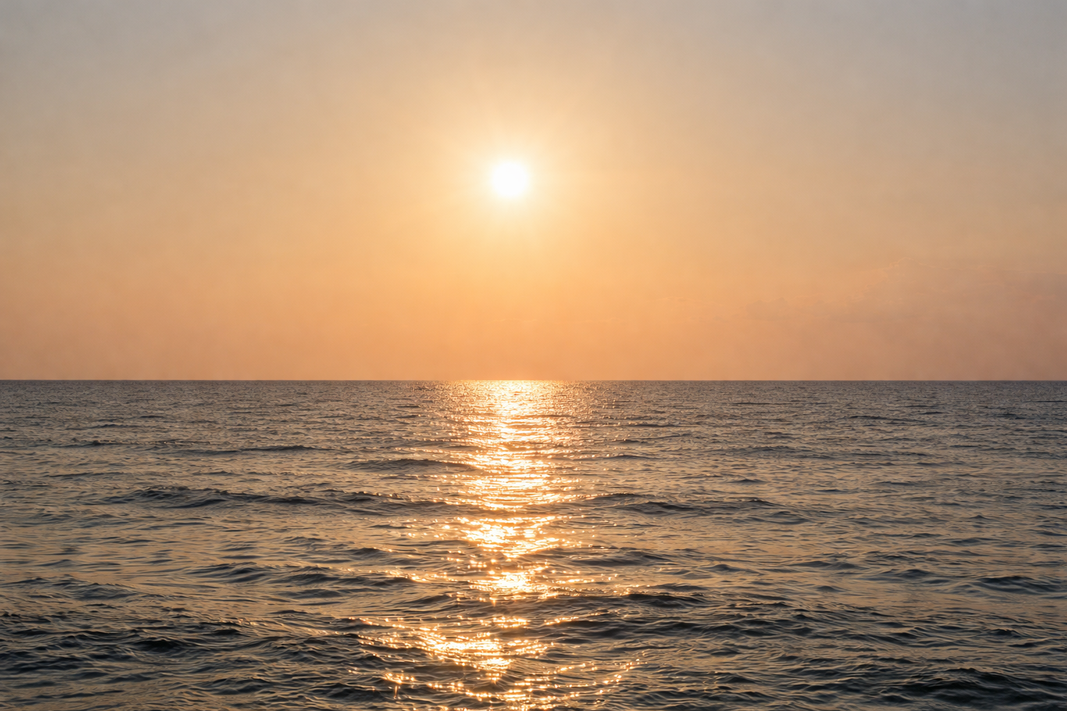 Golden sunset over the calm waters of Patar Beach, West Philippine Sea.